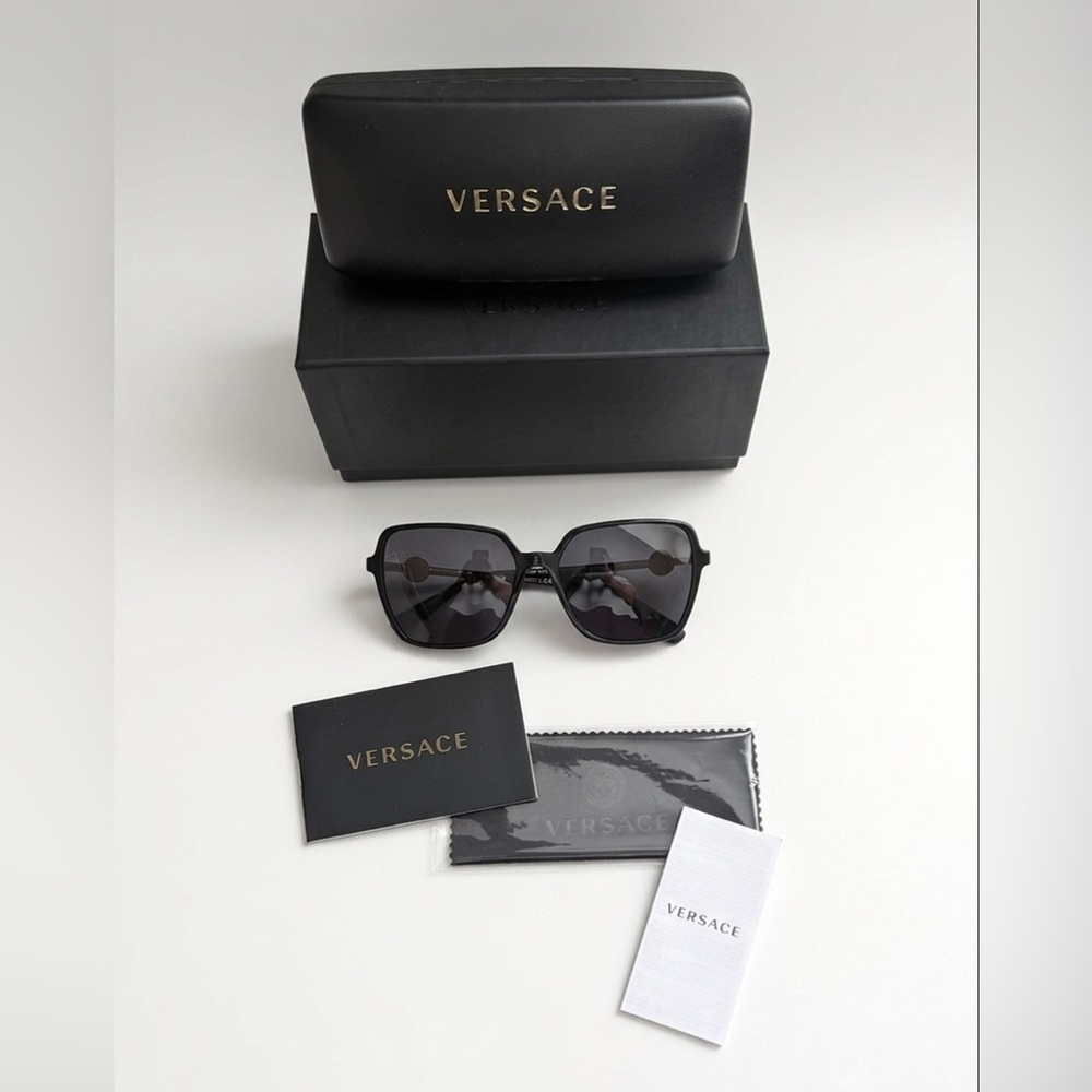 Versace VE4396 square sunglasses in black with dark grey lenses.
